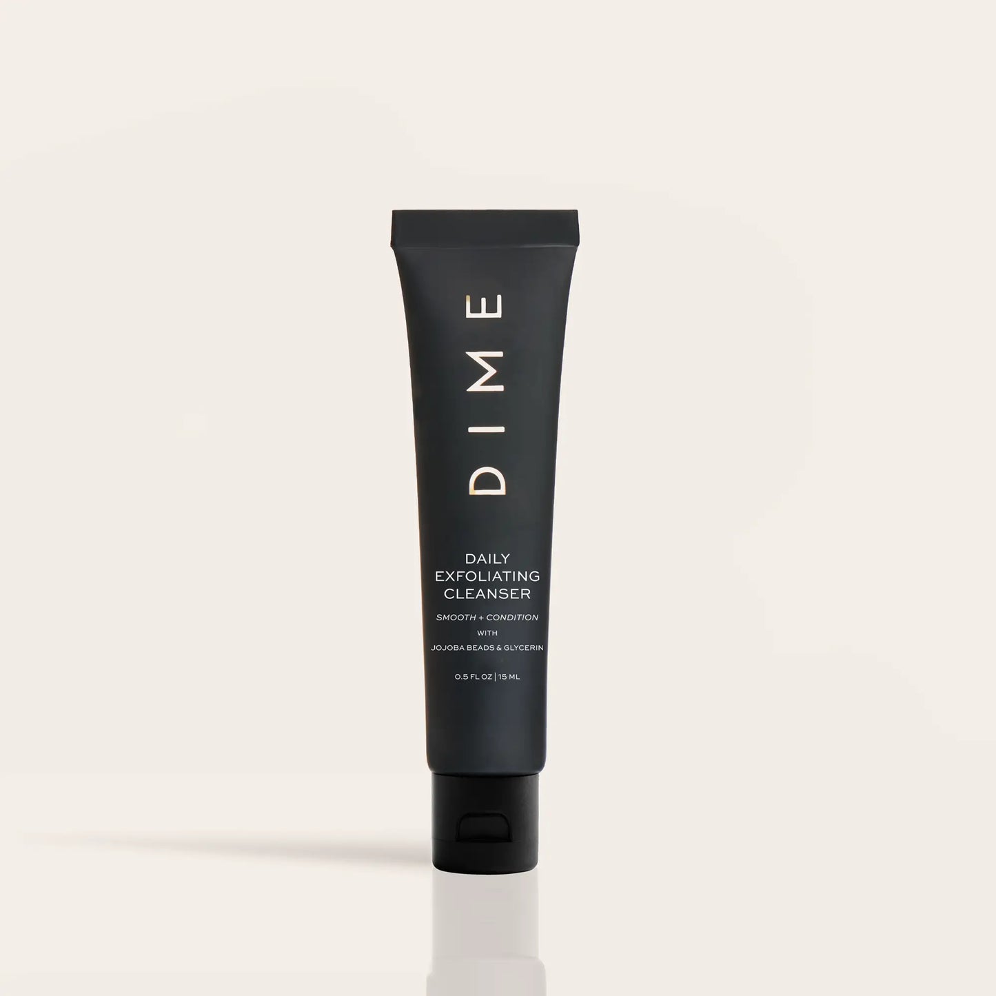 Black tube of DIME Daily Exfoliating Cleanser with white text on neutral background.