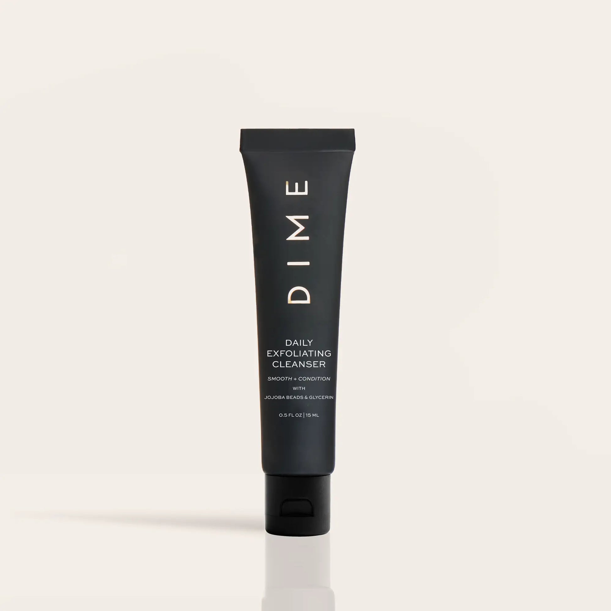 Black tube of DIME Daily Exfoliating Cleanser with white text on neutral background.