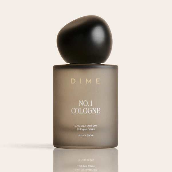DIME No. 1 Cologne in a frosted taupe bottle with black spherical cap, 1.7 fl oz size.