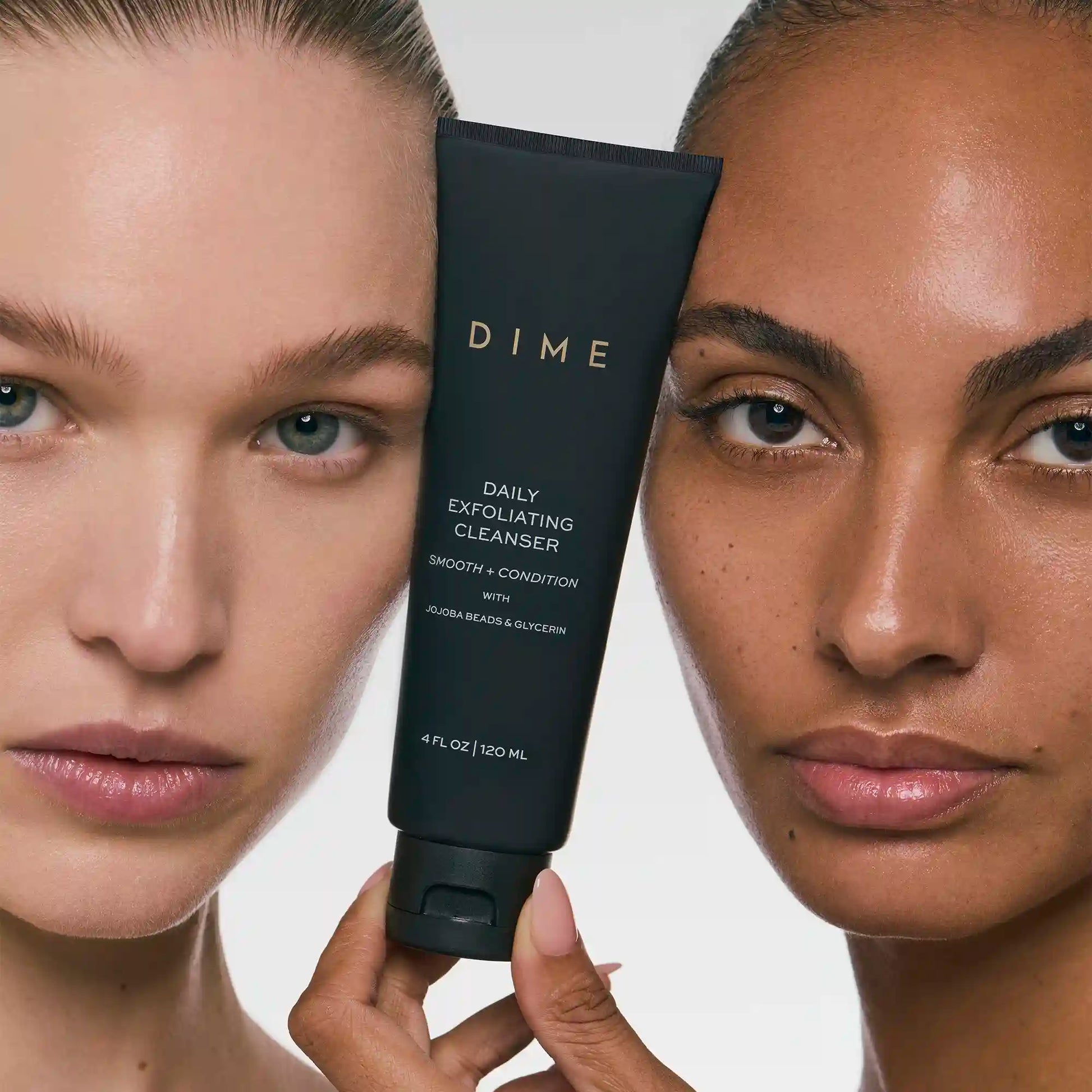 Black tube of Daily Exfoliating Cleanser held between two people with different skin tones showing facial results.