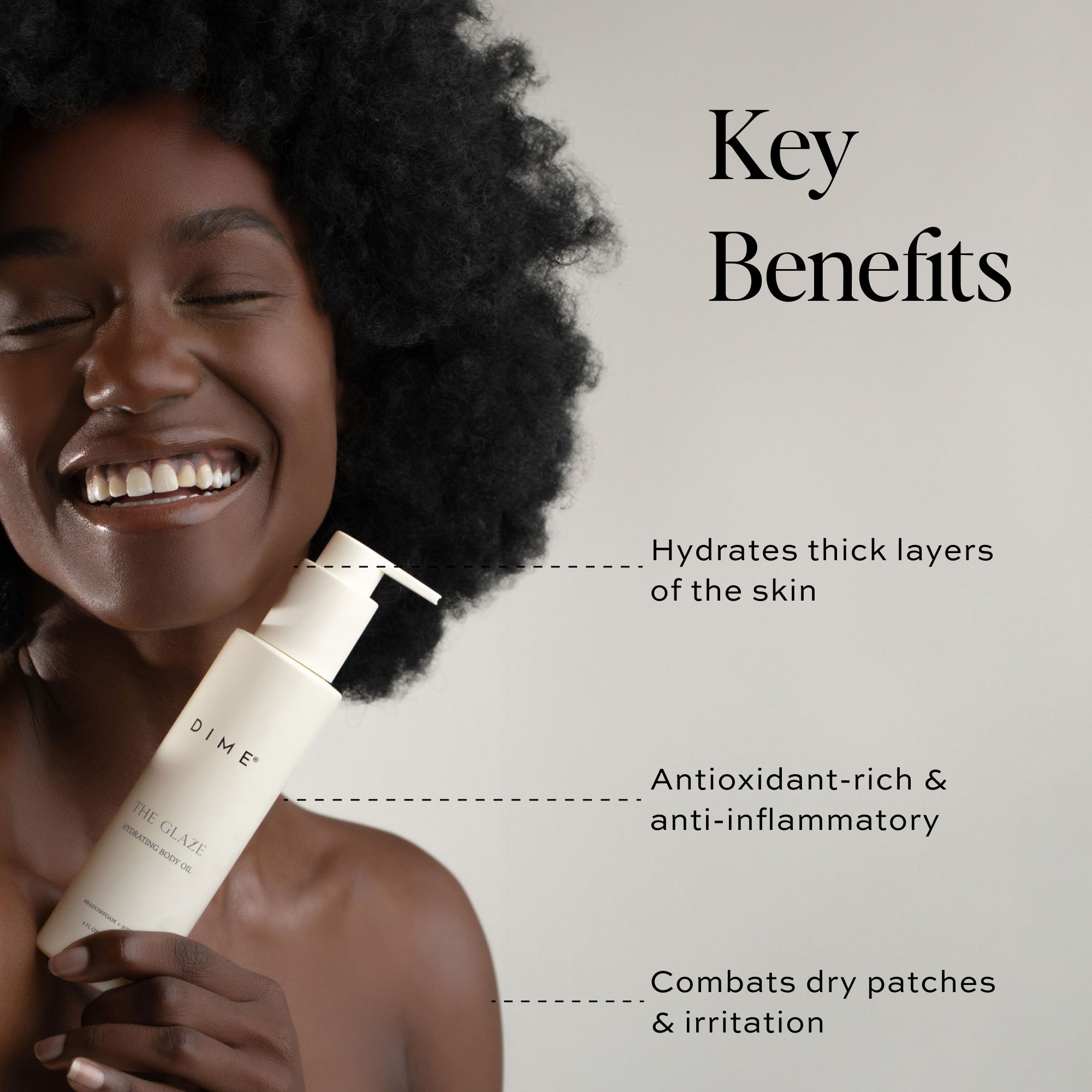 a woman smiling holding a bottle of skincare product