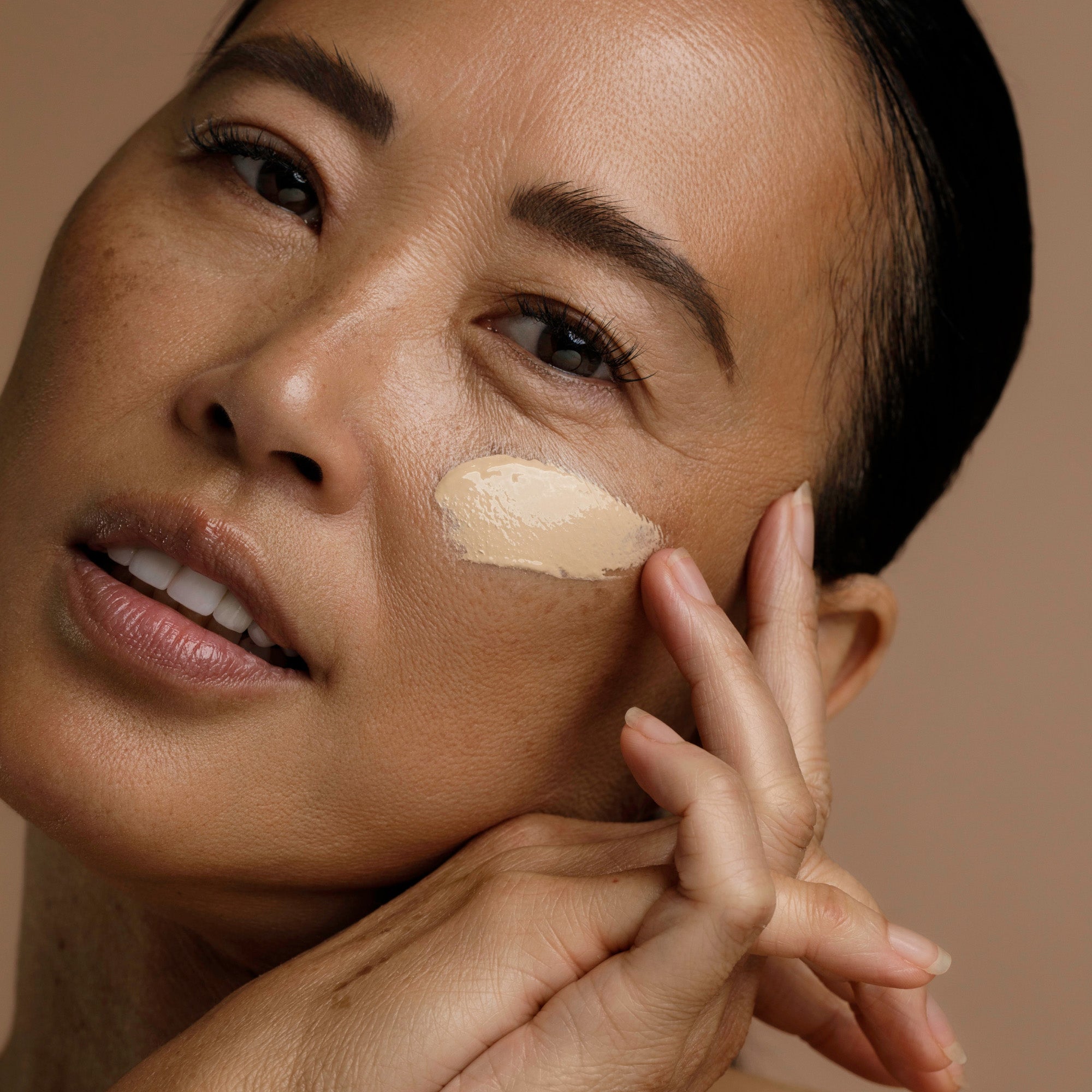 a woman with a foundation on her face