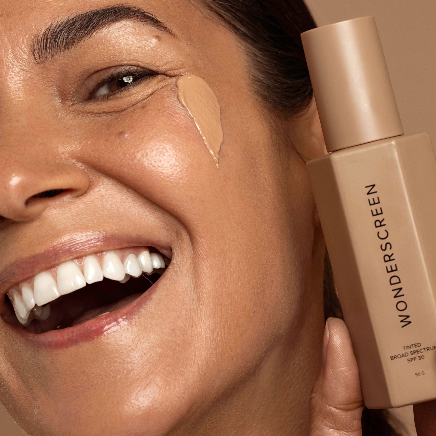 tinted glow wonderscreen swatch on skin